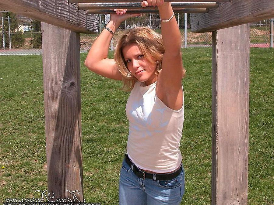 20P Pictures of teen babe Karen Dreams teasing at a park