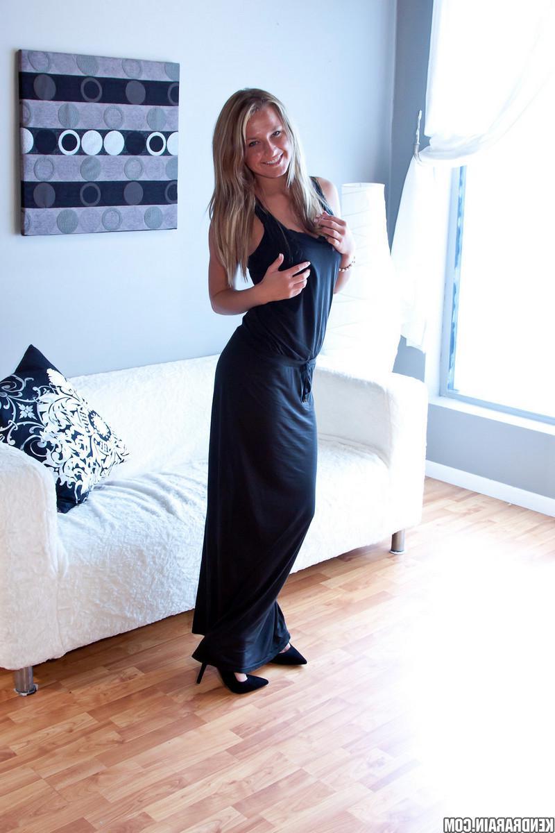 16P Blonde girl Kendra Rain strips out of her long black dress and gets ready for you