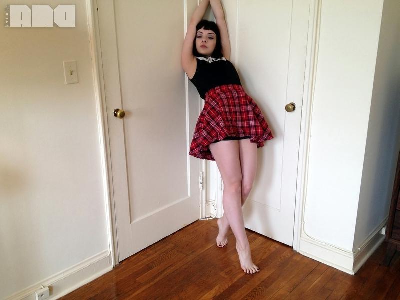 15P Pretty pinup girl Lilly Rose strips out of her plaid skirt at home