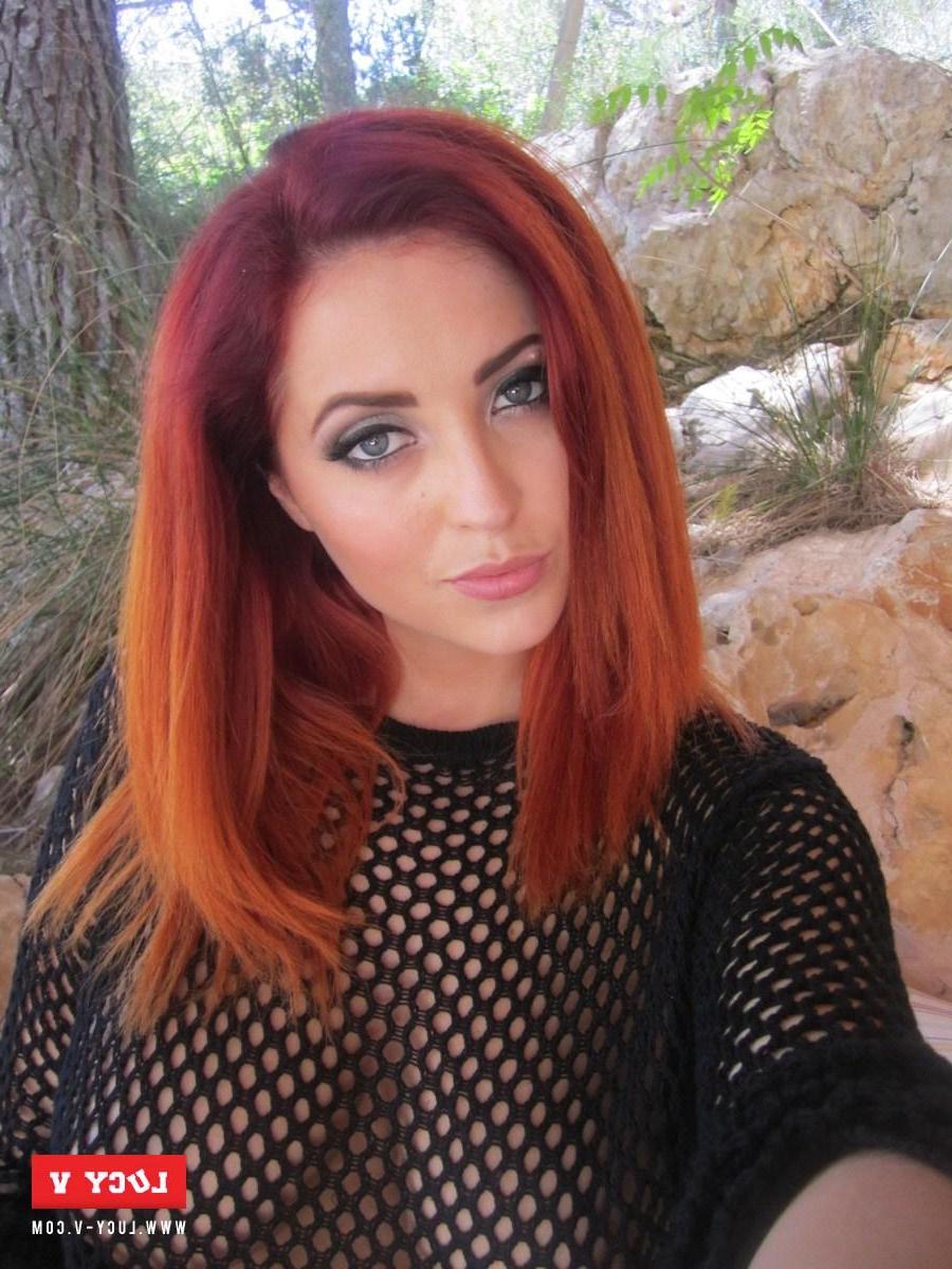 12P Hot redhead teen Lucy V strips her black fishnet top