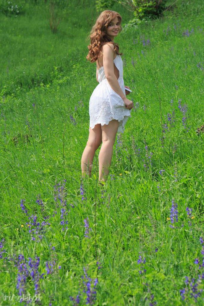 16P Pretty redhead Nedda strips nude outside and shows you her beautiful pussy