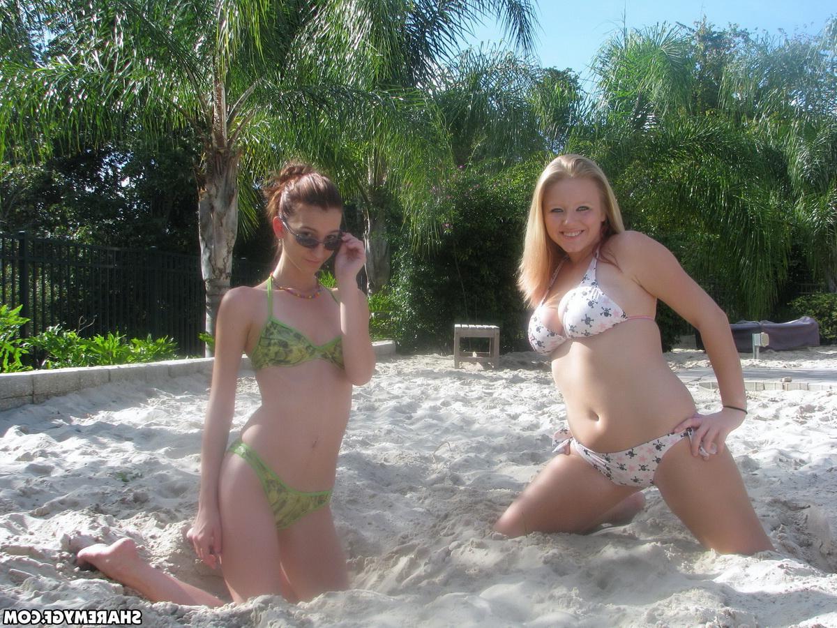 20P Two hot teen girlfriends have some fun on the beach