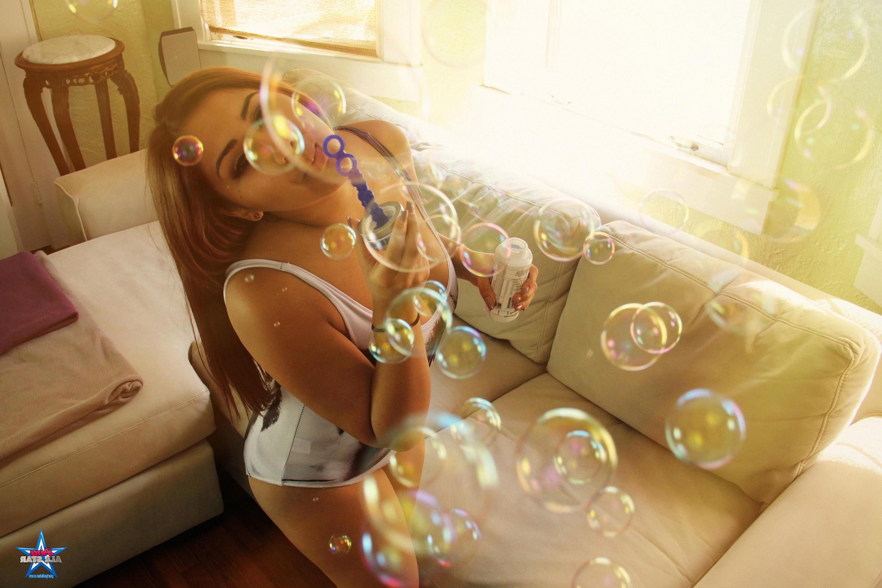 16P Brunette teen Pookie has some fun blowing bubbles