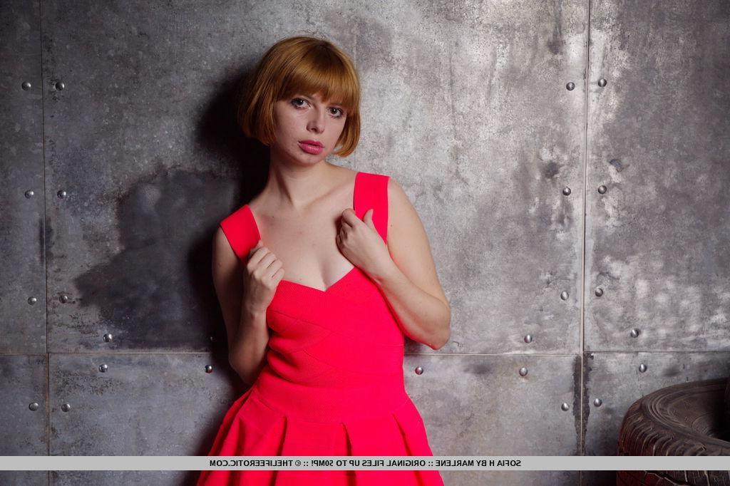 16P Redhead model Sofia H strips out of her red dress for you