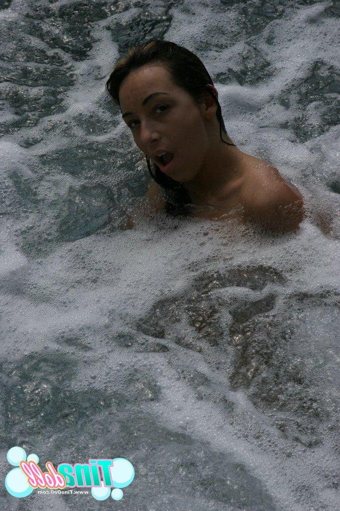15P Tina Doll butt ass naked and splashing around in the hot tub