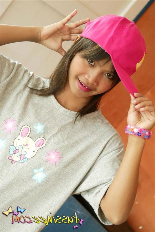 19P Pictures of teen model Tussinee Teen teasing in a night shirt