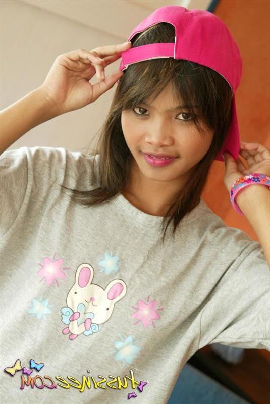19P Pictures of teen model Tussinee Teen teasing in a night shirt