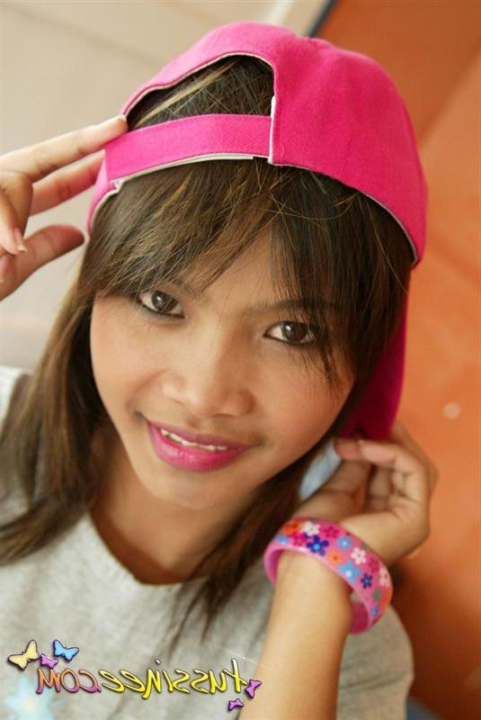 19P Pictures of teen model Tussinee Teen teasing in a night shirt