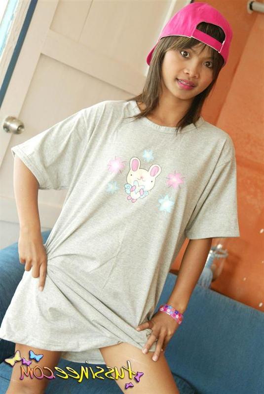 19P Pictures of teen model Tussinee Teen teasing in a night shirt