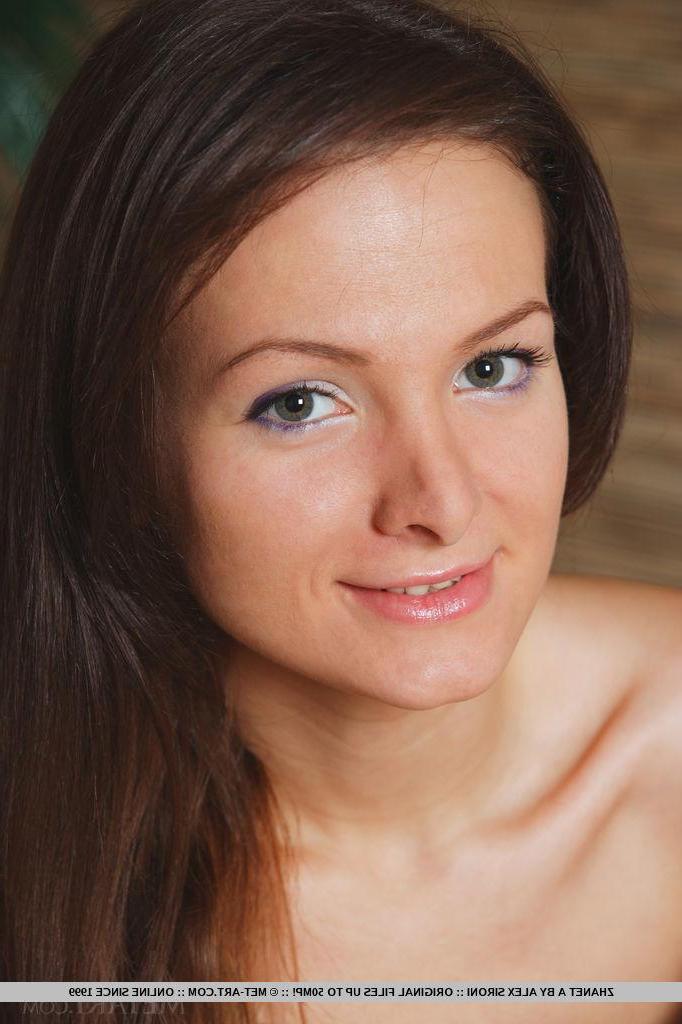 18P Beautiful brunette teen Zhanet A strips nude in bed and waits for you to join in