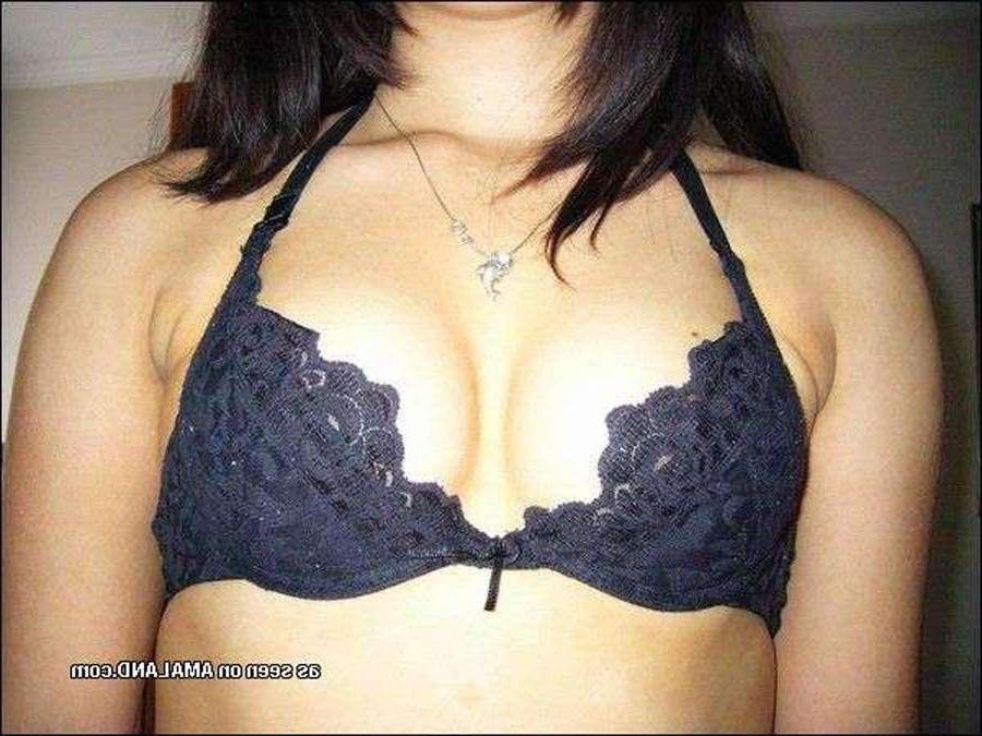 15P Shy Asian chick posing with her ass in a tiny thong