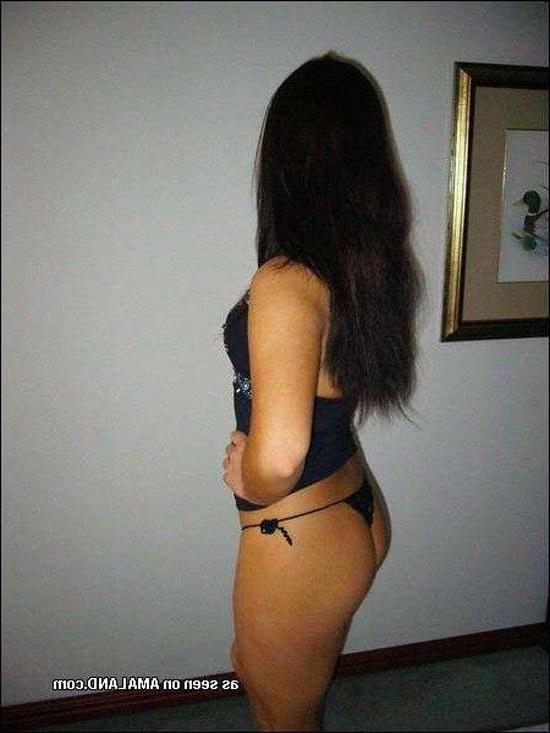 15P Shy Asian chick posing with her ass in a tiny thong