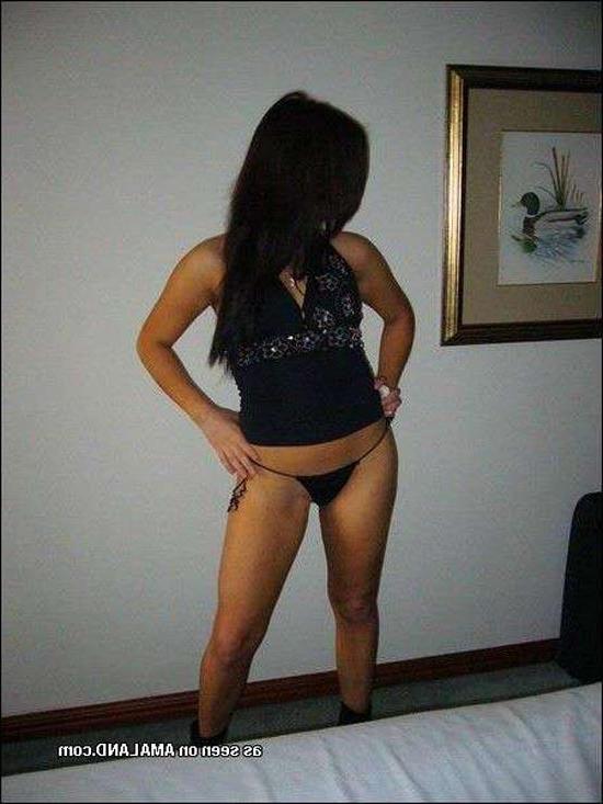 15P Shy Asian chick posing with her ass in a tiny thong