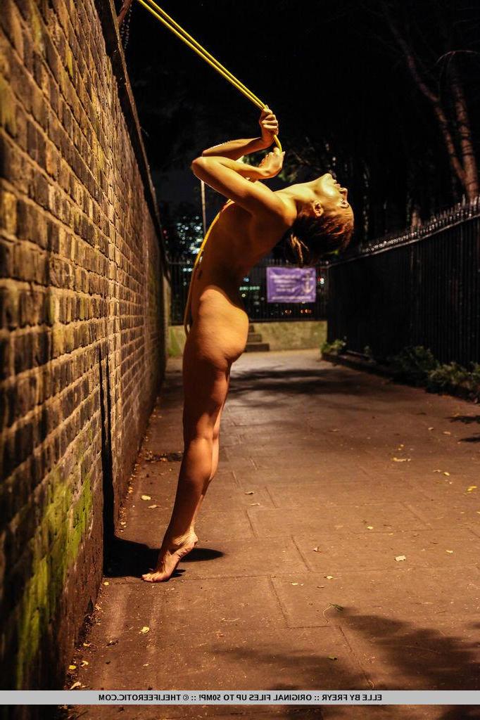 16P Brunette girl Elle attempts to scale a wal lin "Nightlife"