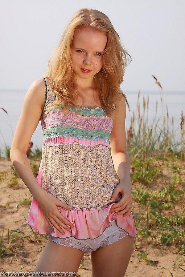 20P Pictures of teen cutie Angie getting nude outside