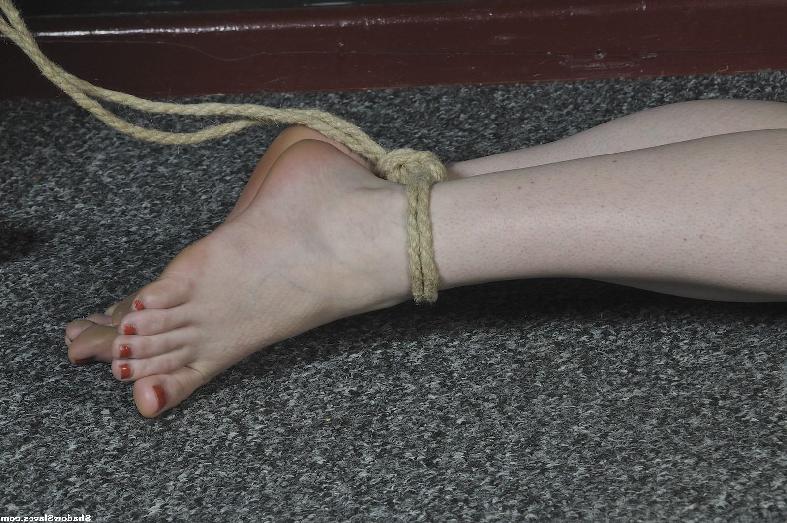 16P Amber West is tied up tightly and then hoisted up to the ceiling