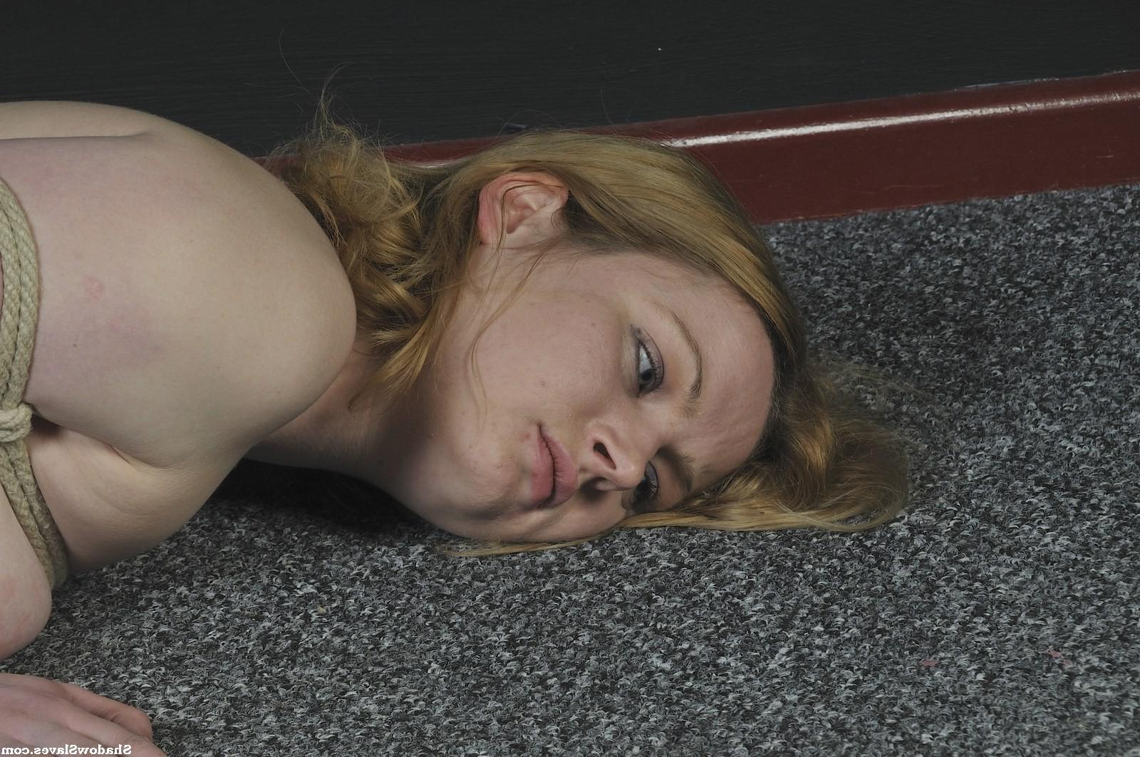 16P Amber West is tied up tightly and then hoisted up to the ceiling