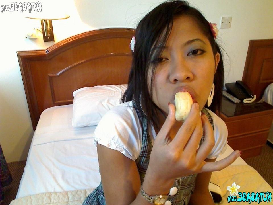 16P Asian Bali teen girl blows banana