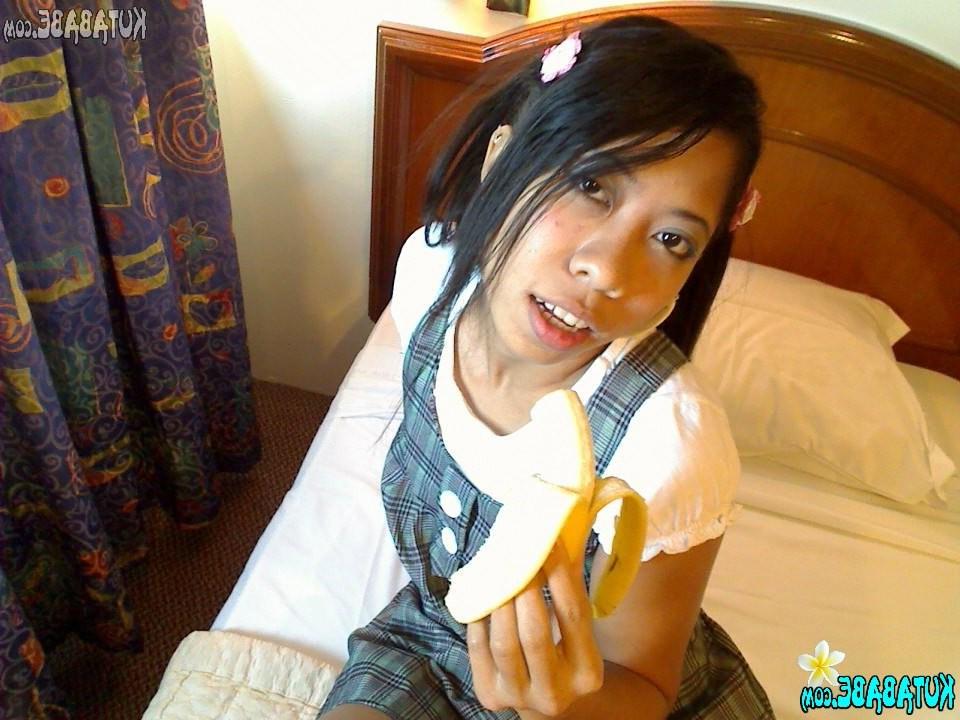 16P Asian Bali teen girl blows banana