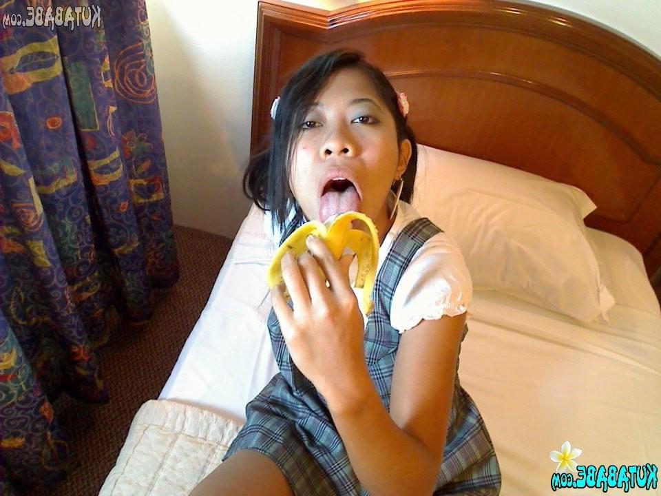16P Asian Bali teen girl blows banana