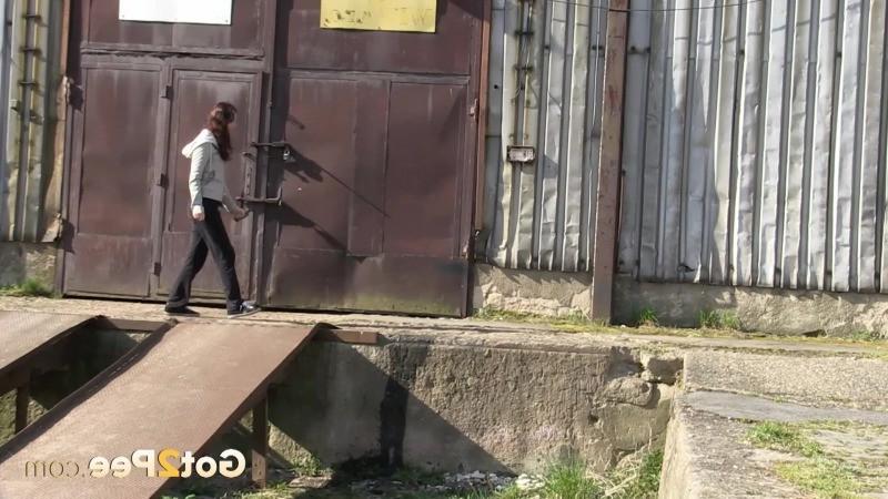 15P Gorgeous brunette filmed twice pissing outside