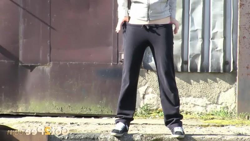 15P Gorgeous brunette filmed twice pissing outside