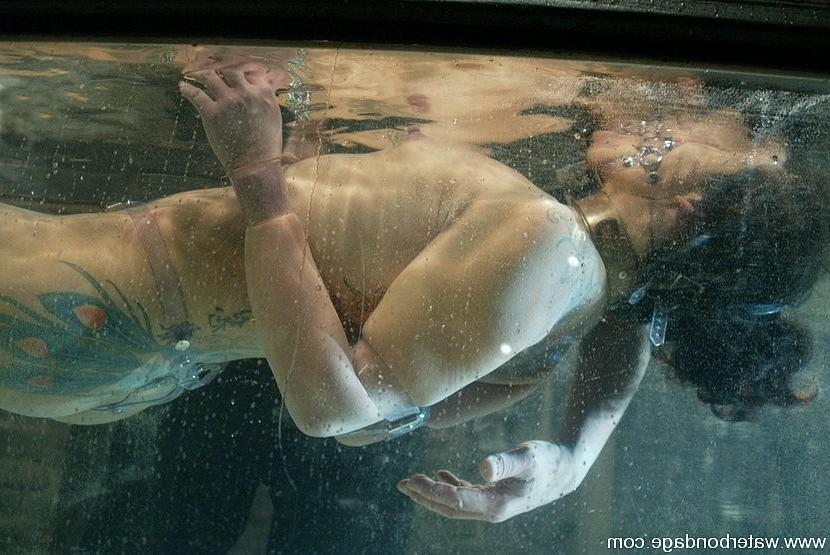 15P Asian tattoo babe is bound in rope and put in water tank