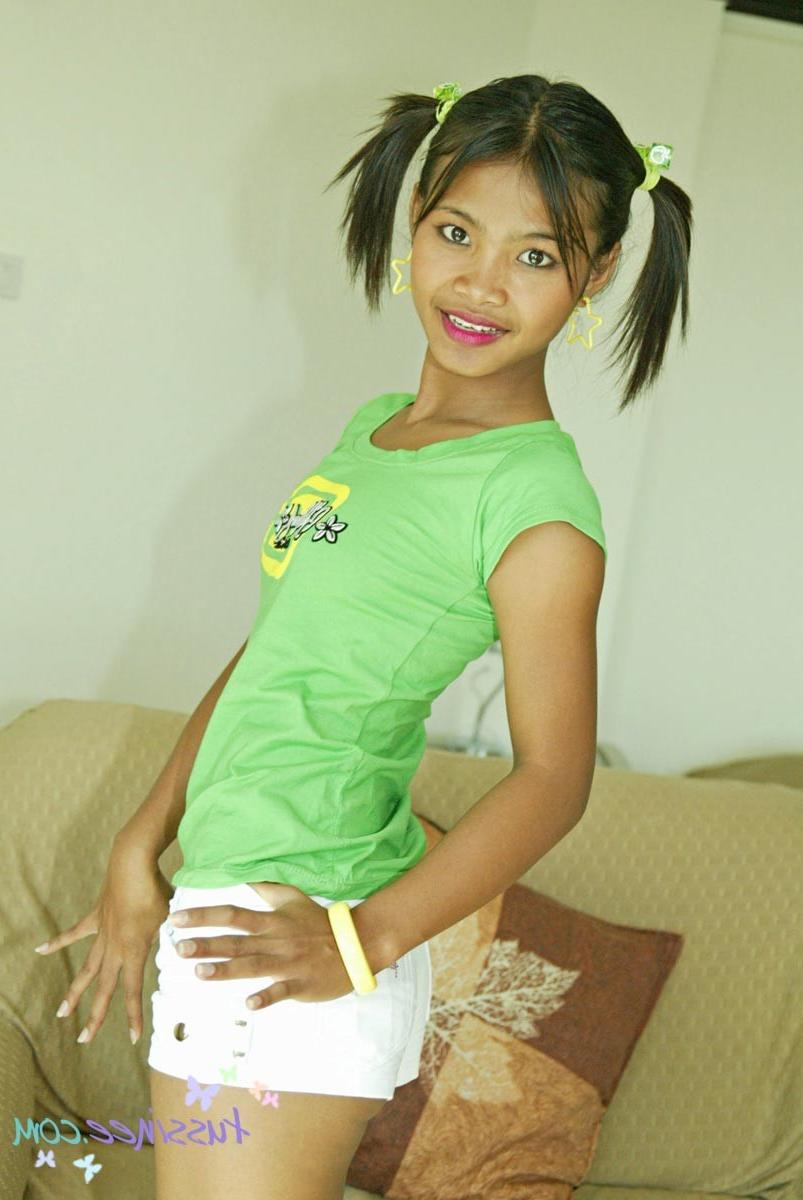 15P Asian Amateur Tussinee in pigtails gets naked