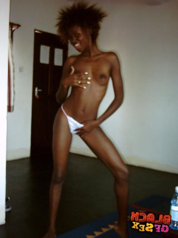 12P Very slim black cutie uncovers the nudity