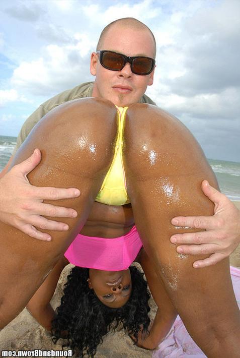 14P This smokin hot ebony babe takes the thong to the beach and shows us how it is