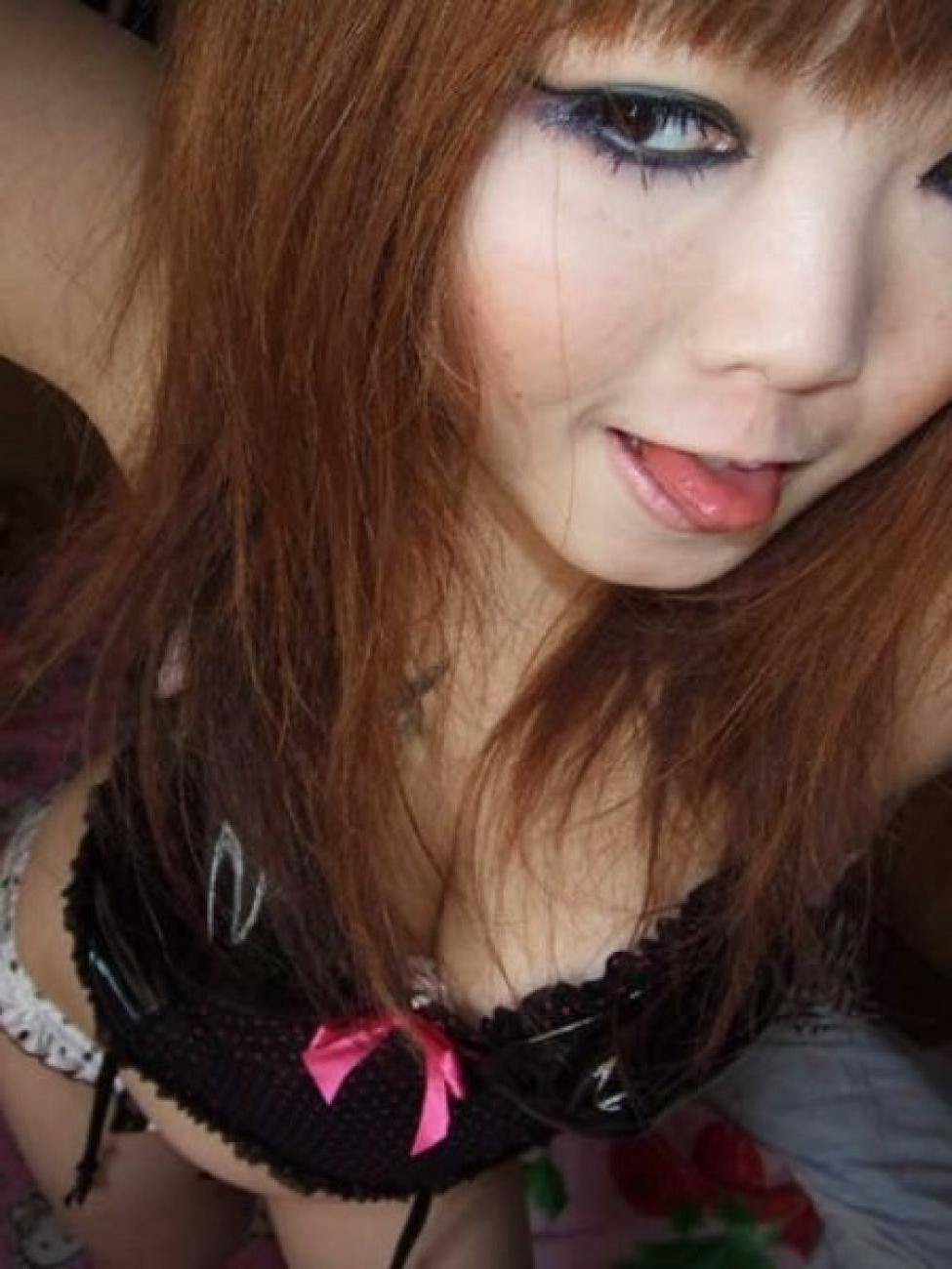 16P Asian does a stiptease befoe sliding her pussy on huge cock