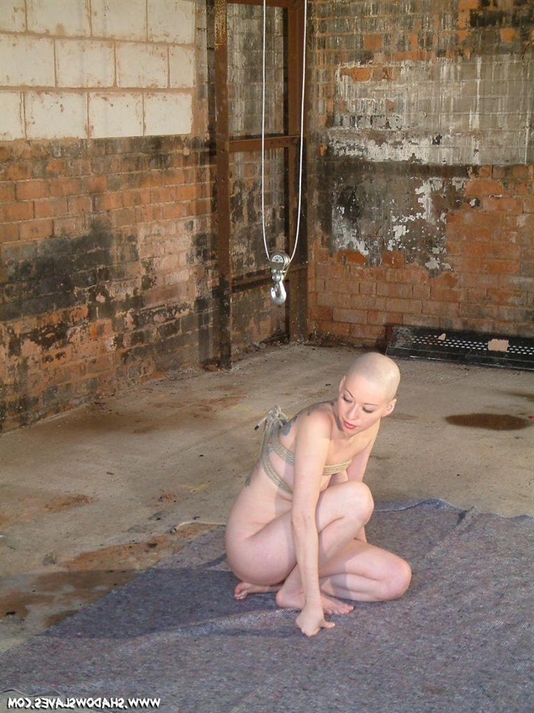 15P Bald asian slavegirl wriggles around in rope suspension bondage
