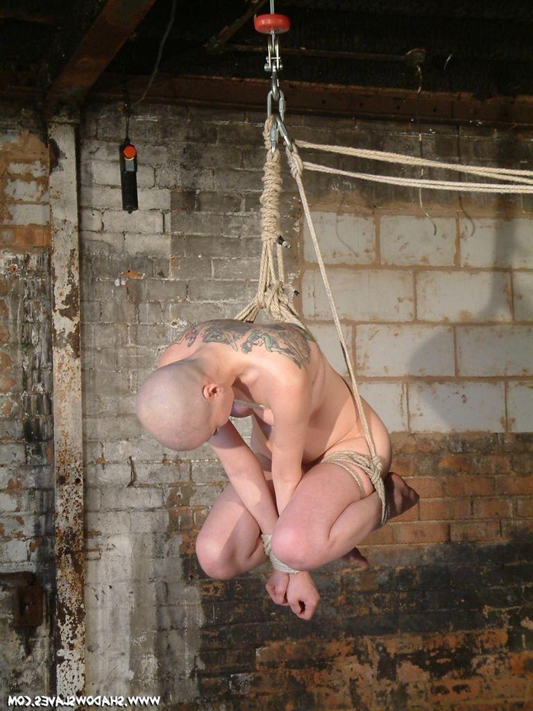 15P Bald asian slavegirl wriggles around in rope suspension bondage