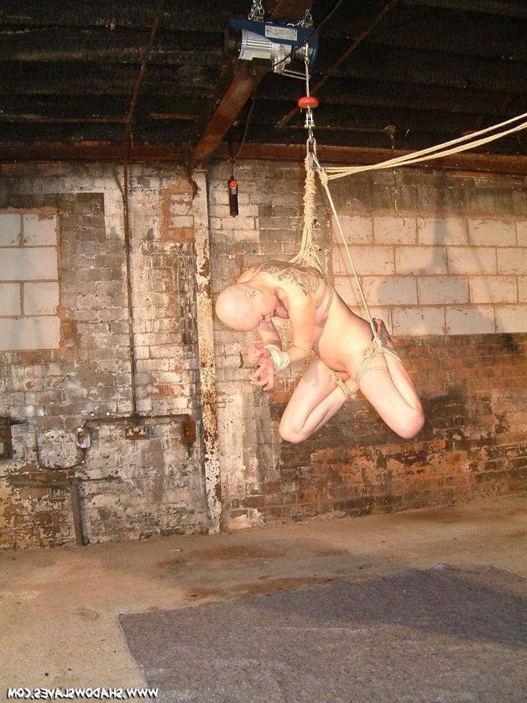15P Bald asian slavegirl wriggles around in rope suspension bondage