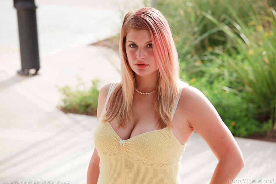 15P A voluptuous chick outdoors flashing her big tits