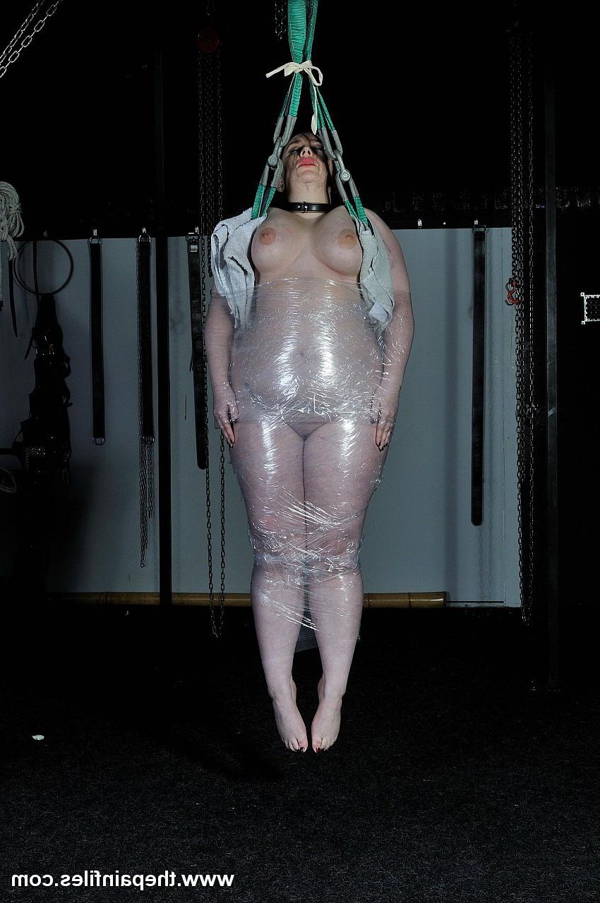 16P Amateur  BBW is wrapped in saran and then suspended in a bondage