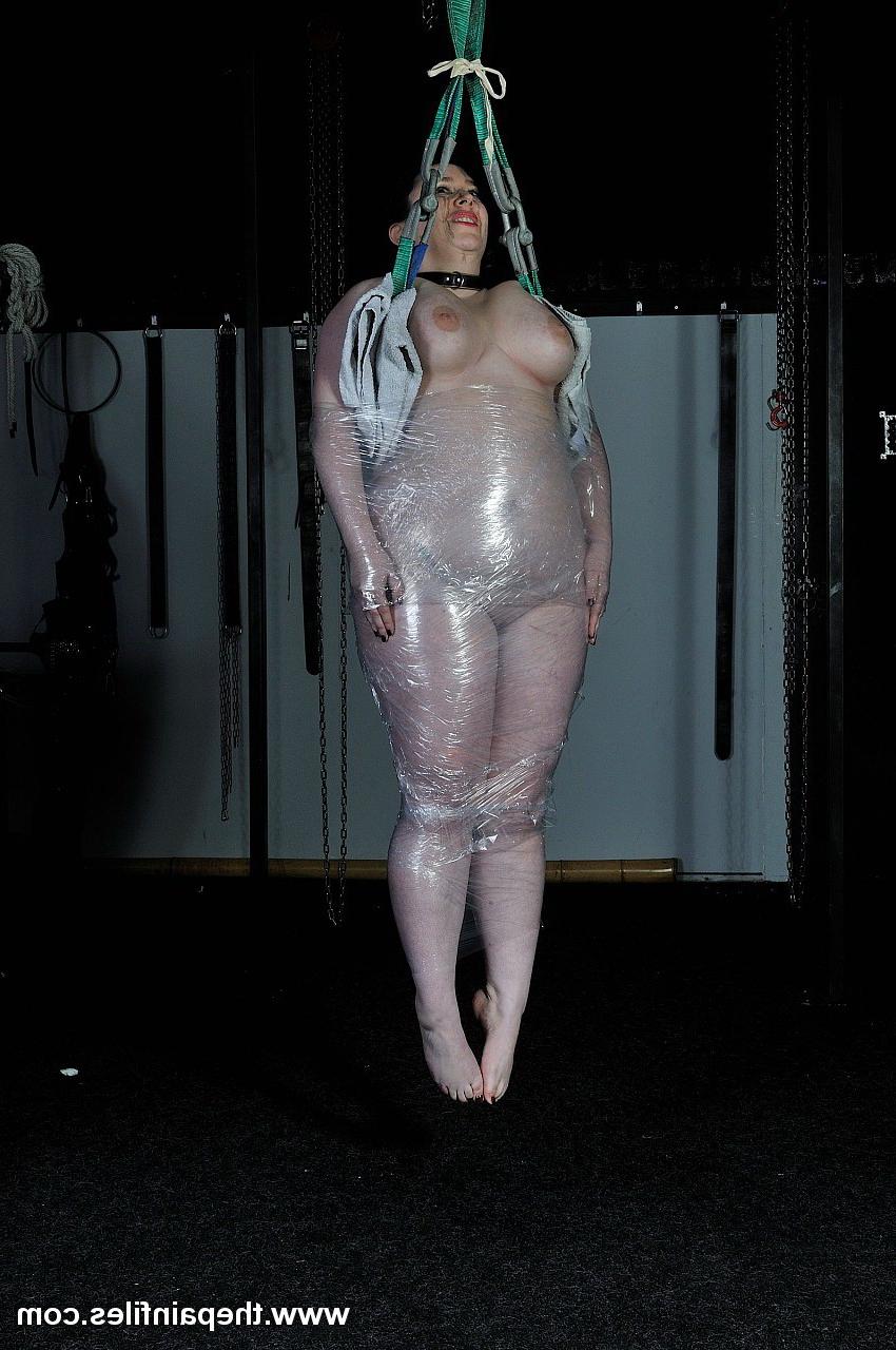 16P Amateur  BBW is wrapped in saran and then suspended in a bondage