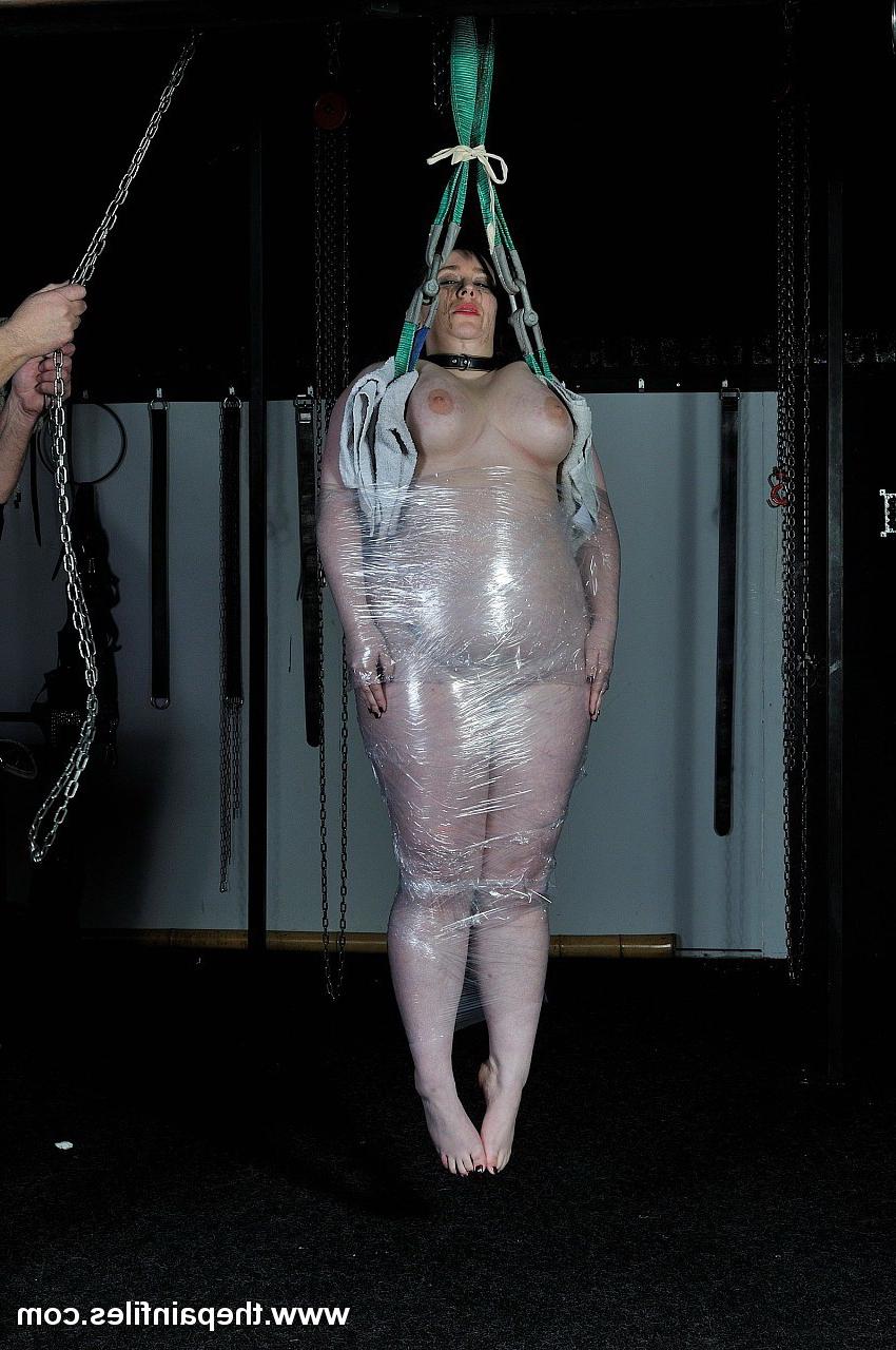 16P Amateur  BBW is wrapped in saran and then suspended in a bondage