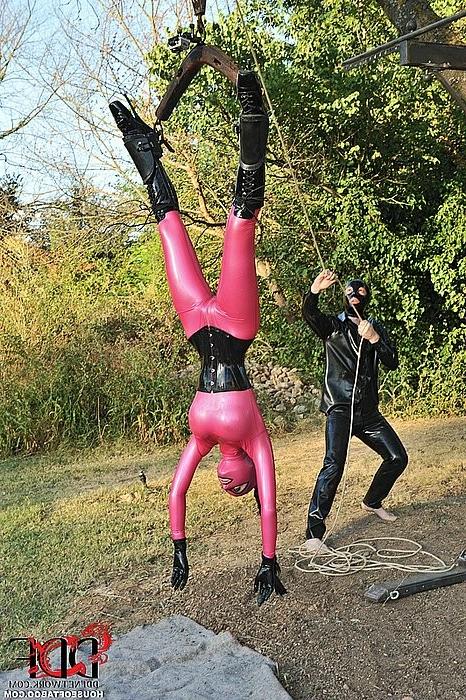 16P Latex Lucy in pink latex sucking cock while hanging upside down
