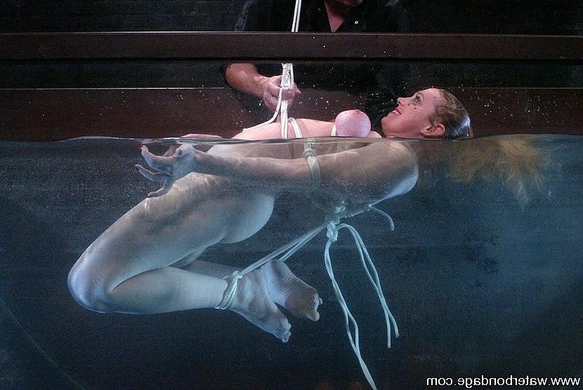 15P Darling busty blonde beauty is rope bound in water