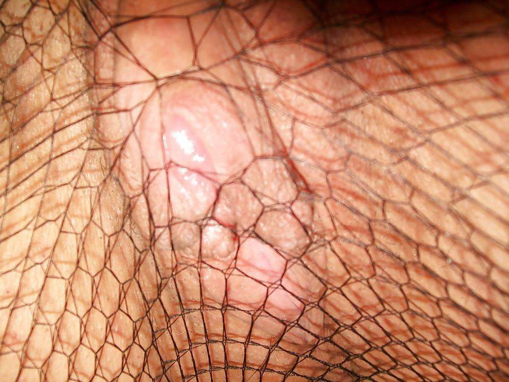 9P Pussy & clit peeping out of the fishnets