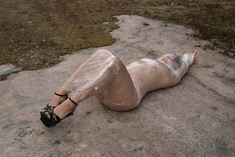 20P Girl tied up outdoors with plastic wrap