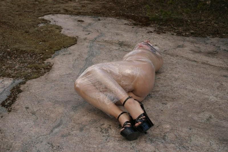 20P Girl tied up outdoors with plastic wrap