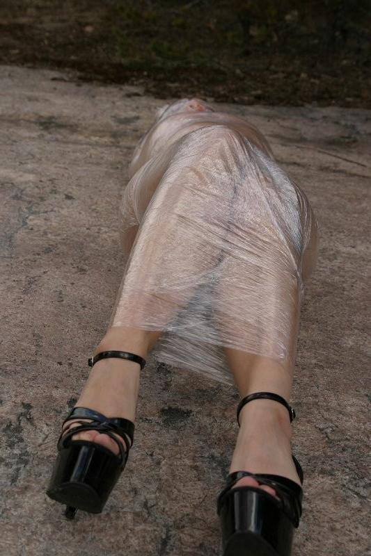 20P Girl tied up outdoors with plastic wrap