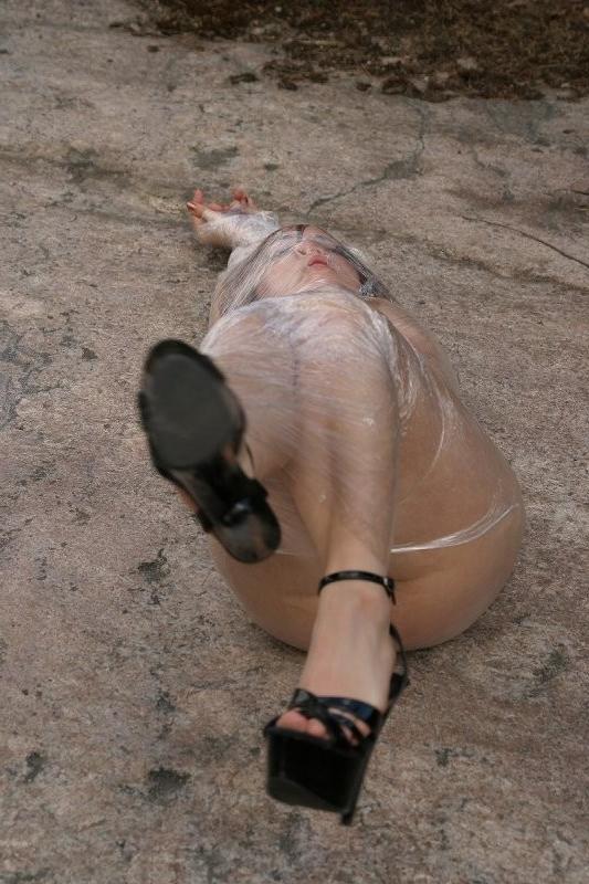 20P Girl tied up outdoors with plastic wrap