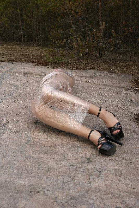 20P Girl tied up outdoors with plastic wrap