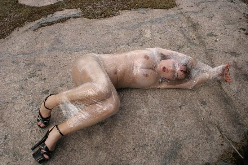 20P Girl tied up outdoors with plastic wrap