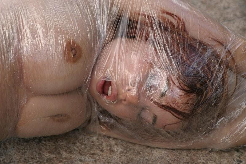20P Girl tied up outdoors with plastic wrap