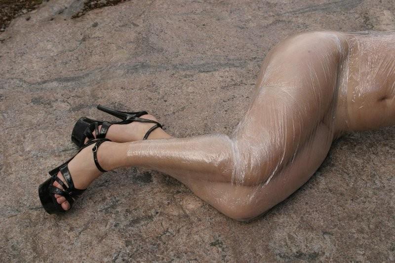 20P Girl tied up outdoors with plastic wrap