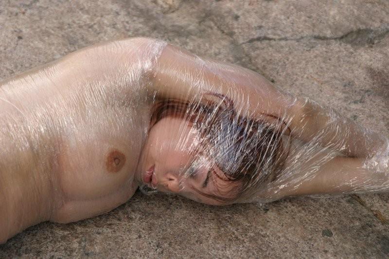 20P Girl tied up outdoors with plastic wrap